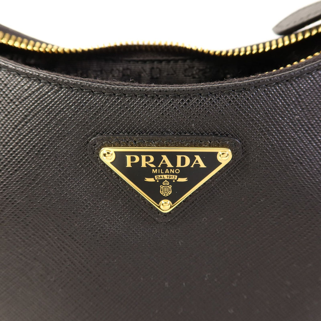 Prada Saffiano Leather Re-edition 2005 Golden Shoulder Bag Black Calfskin Condition: SA (NEW)