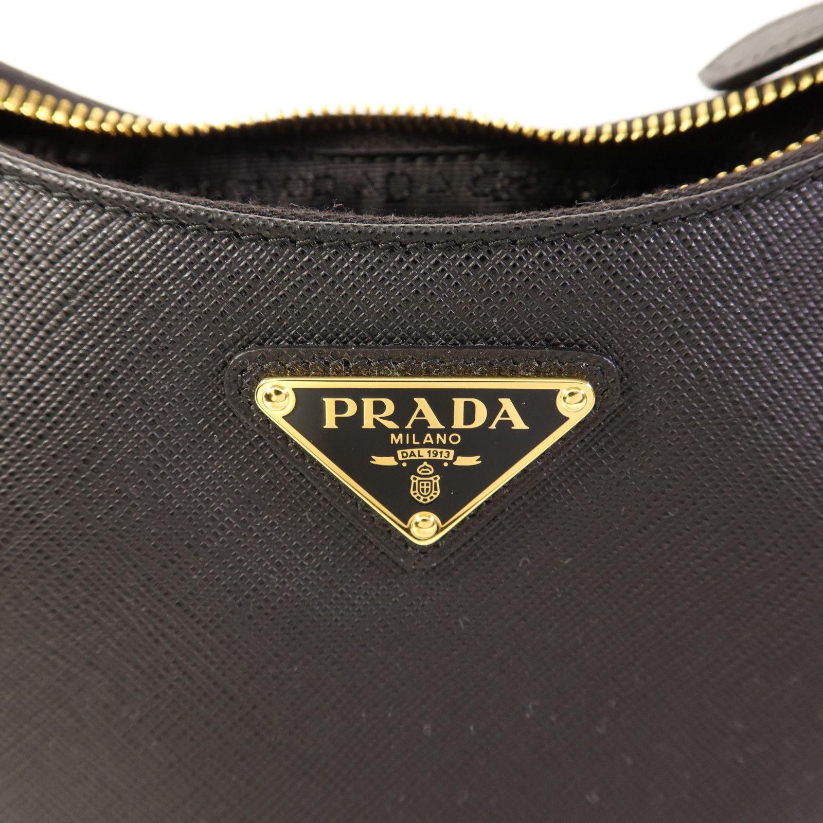 Prada Saffiano Leather Re-edition 2005 Golden Shoulder Bag Black Calfskin Condition: SA (NEW)