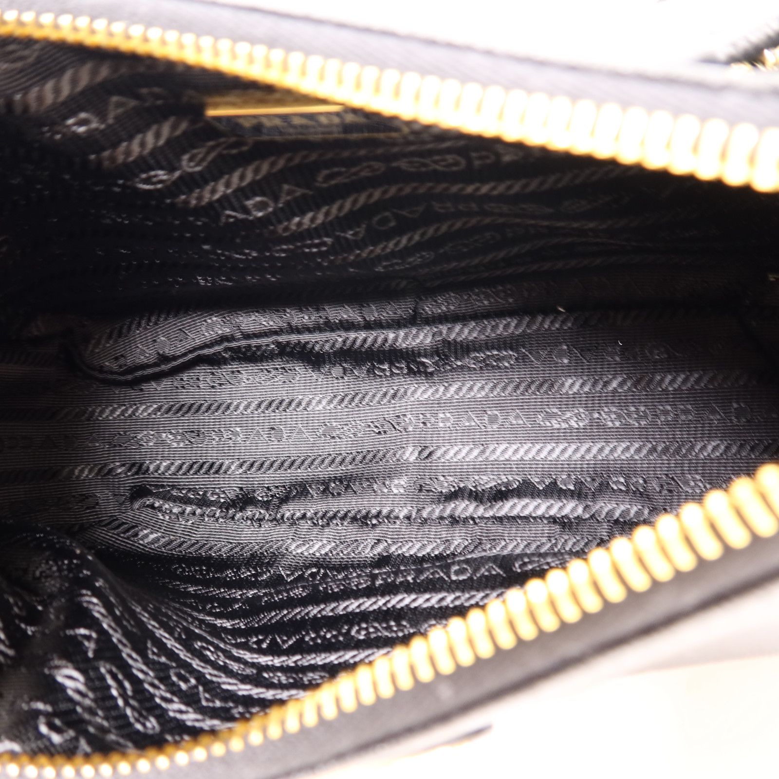 Prada Leather Re-edition 2005 Golden Shoulder Back Bag Black Saffiano